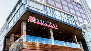 Upwards facing shot of exterior of Matchbox restaurant.