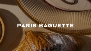 Chocolate croissant on table with Paris Baguette text.